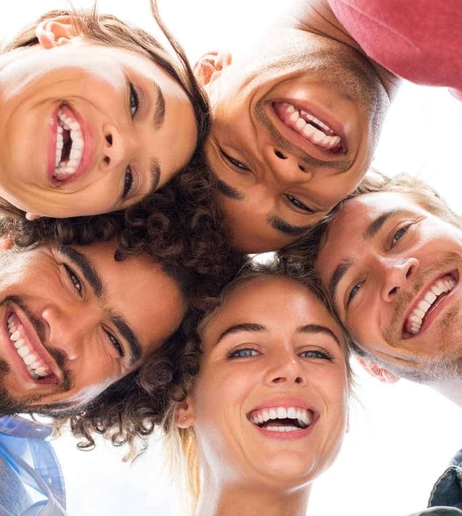 Smiling person showcasing white teeth after laser whitening treatment Oxford